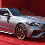 Mercedes-Benz C-Class 2022 W206 metallic grey front view in red background