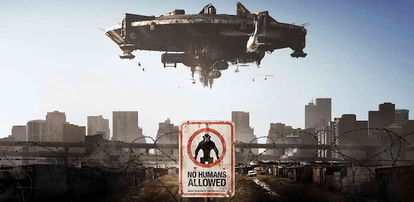 District 9 movie wallpaper sign displaying no humans allowed message and a spaceship over city buildings