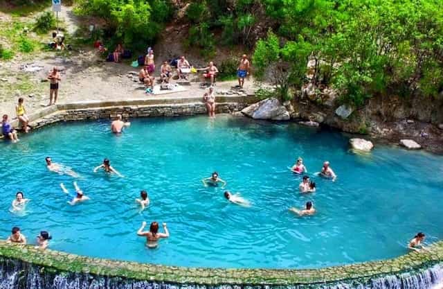 People bathing in thermal Bath in Benja