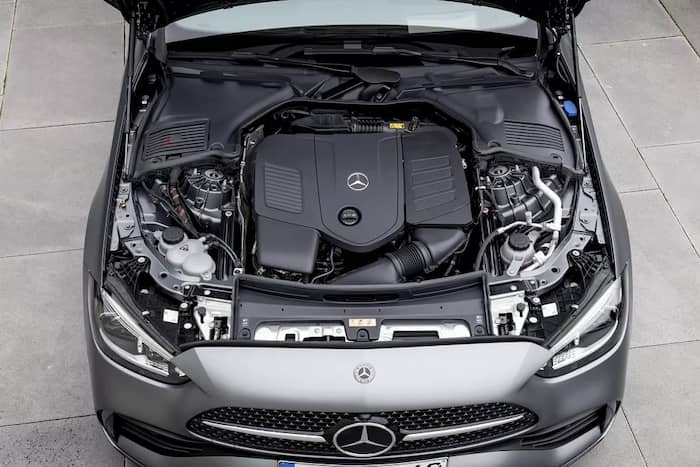 Mercedes-Benz C-Class 2022 W206 open hood lid engine bay black plastic grey metallic color.
