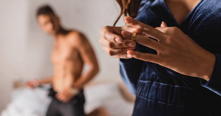 woman cheating with her lover removes her ring