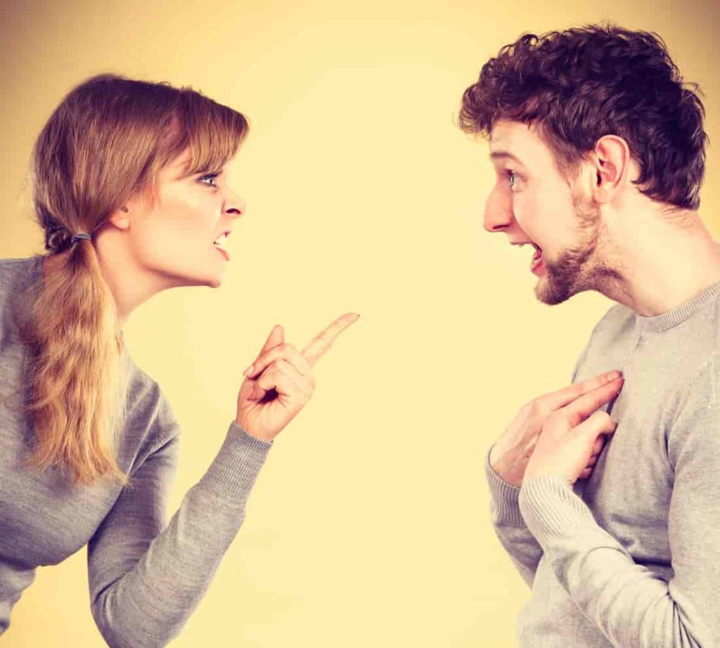 Young couple arguing and yelling on each other