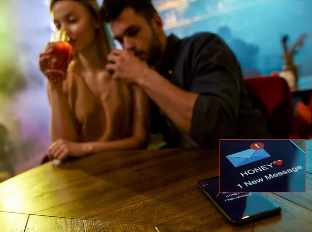 woman drinks beer with her lover while husband is calling on the phone