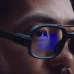 Asian brunette man with mustache wearing black Xiaomi Smart Glasses