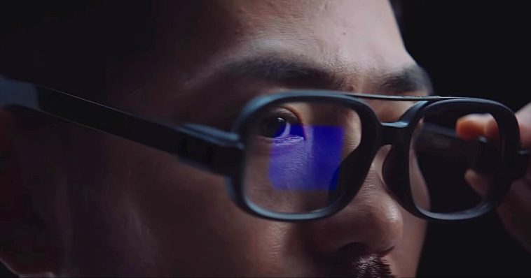 Asian brunette man with mustache wearing black Xiaomi Smart Glasses