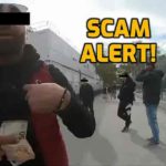 Street scammer holding money in his hand
