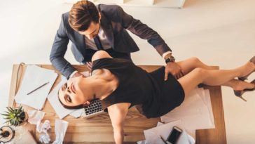 couple being erotic at workplace office