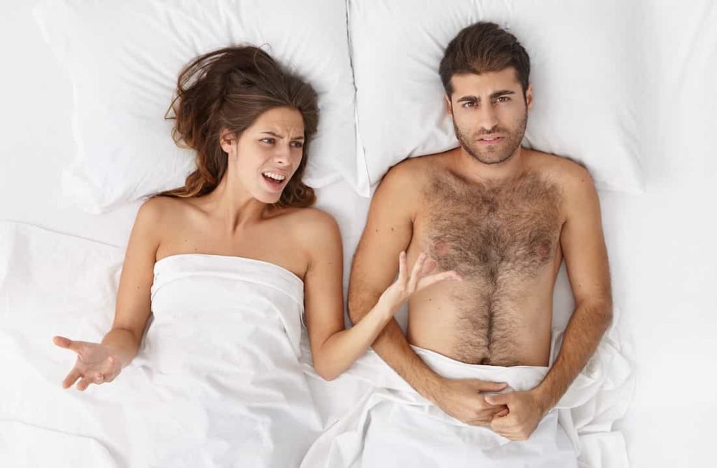 woman complaining to her man about his sexual performance in bed