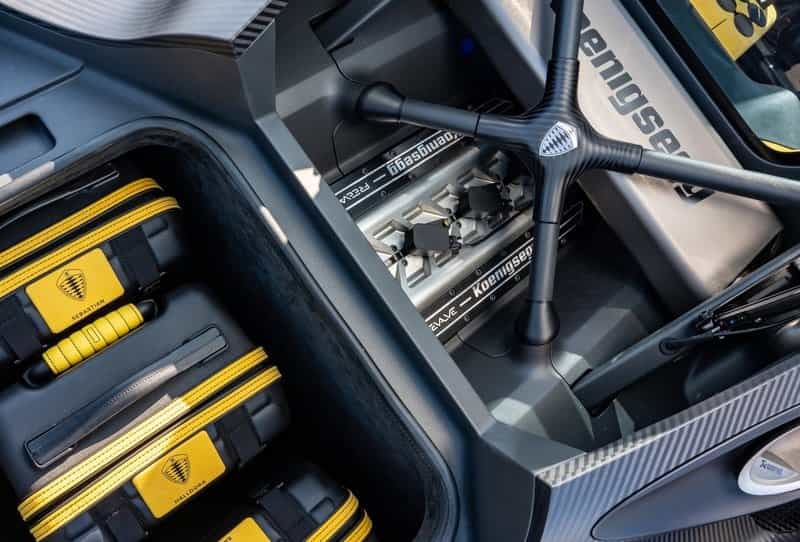 Koenigsegg Gemera engine bay and trunk with yellow suitcases